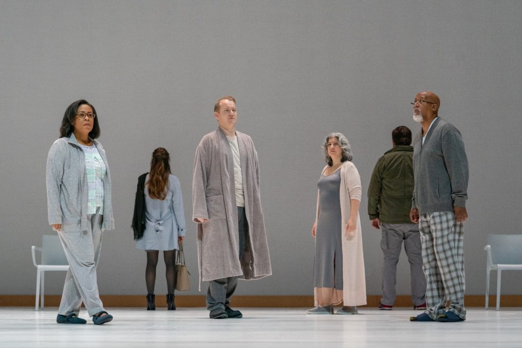 Multiple actors on stage in pajamas - Photo by Dominic Mercier