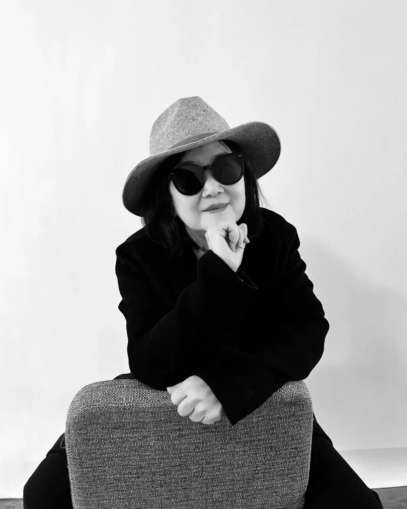 Mom poses, channeling Yoko Ono. 
