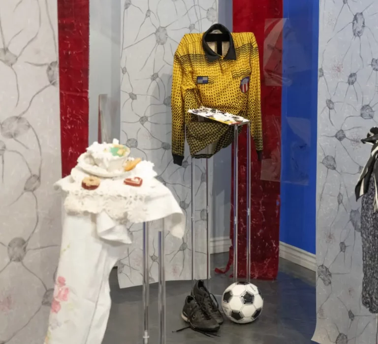 Personal memorabilia, accompanying the audio stories submitted by caregivers and loved ones, showcase the lives of those who are or have lived with dementia. The referee uniform is that of Moe Irilian, the artist’s husband.