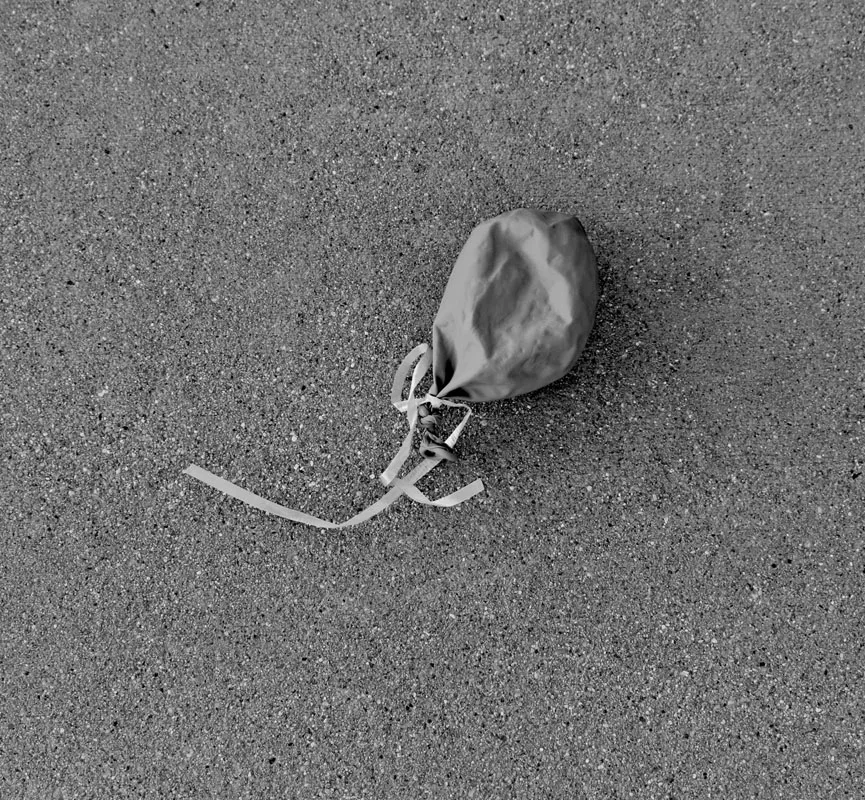 Photo of deflated balloon on the ground. Katie Benson