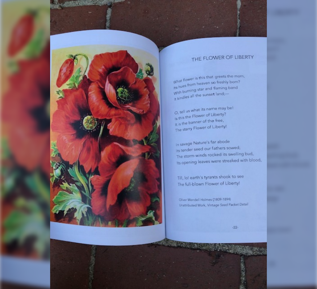Book open to a page with red flowers titled, "The Flower of Liberty." (Laurette Klier)