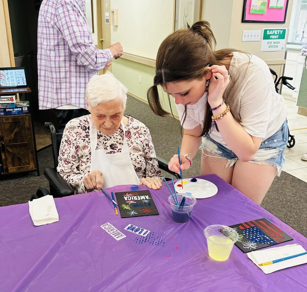 Roselyn helping resident mix paint