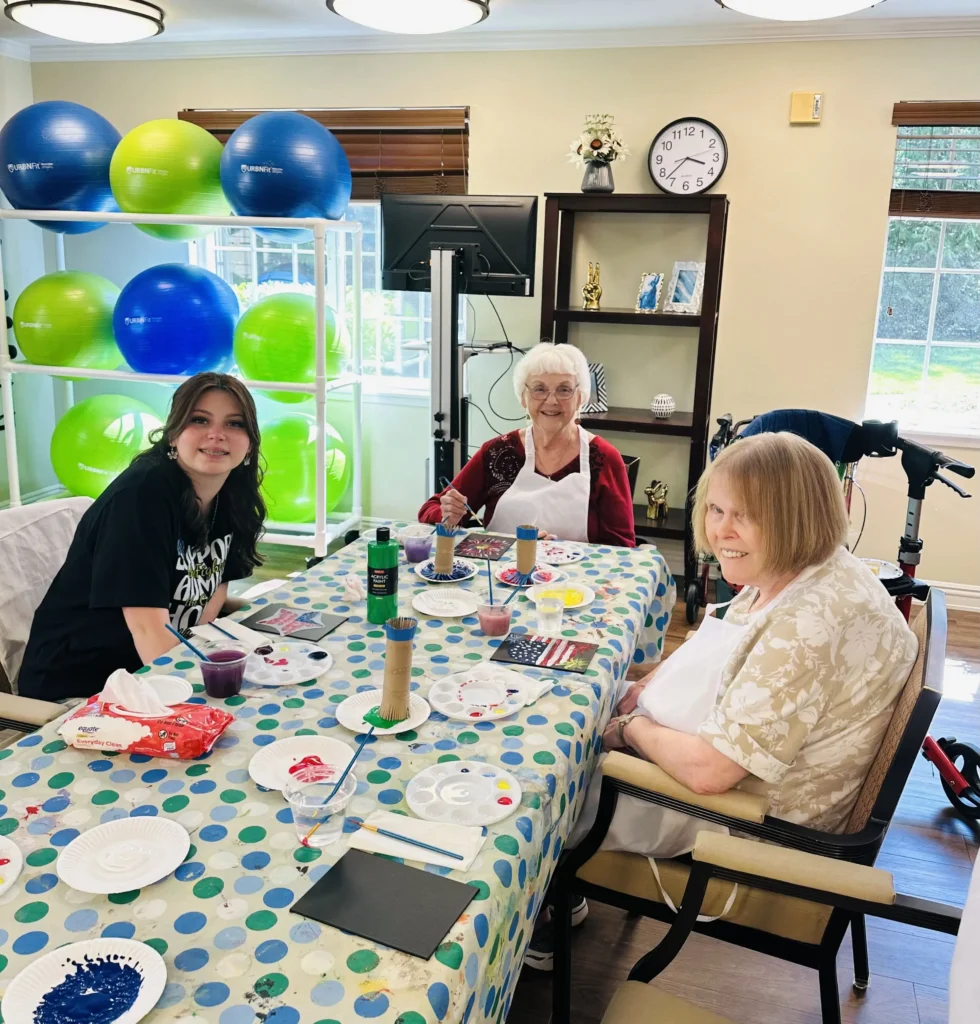 Roselyn with residents at table