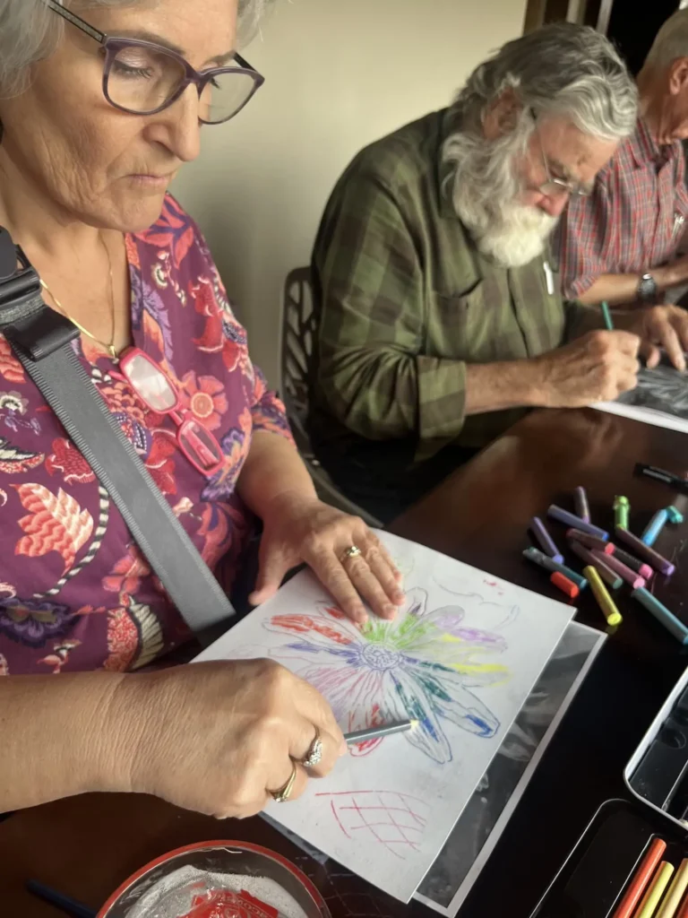 Man and woman painting flowers