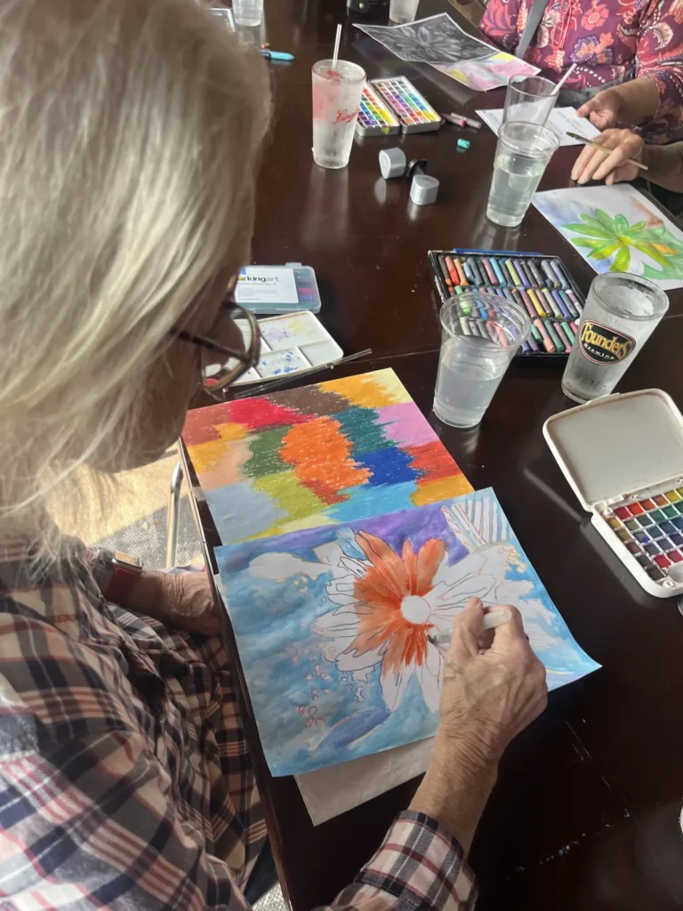 Woman painting a flower