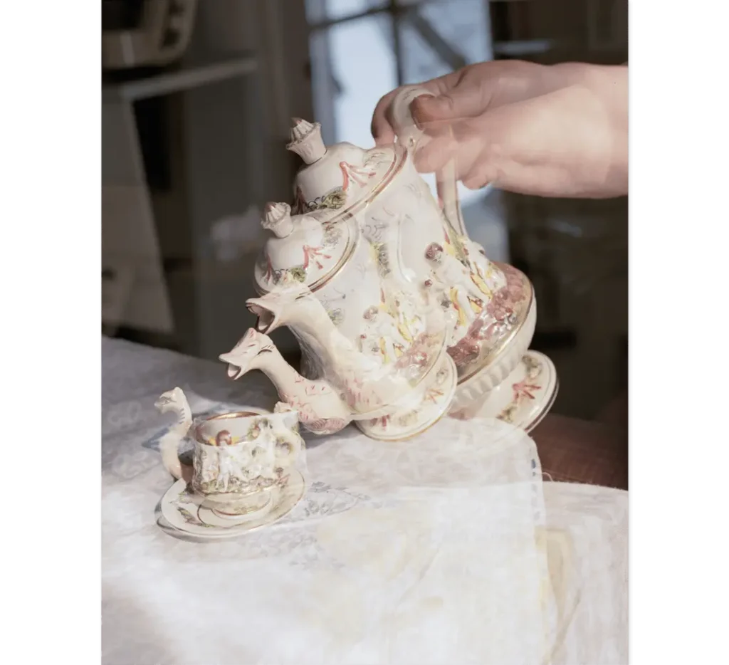 Double exposure of an antique family teapot.