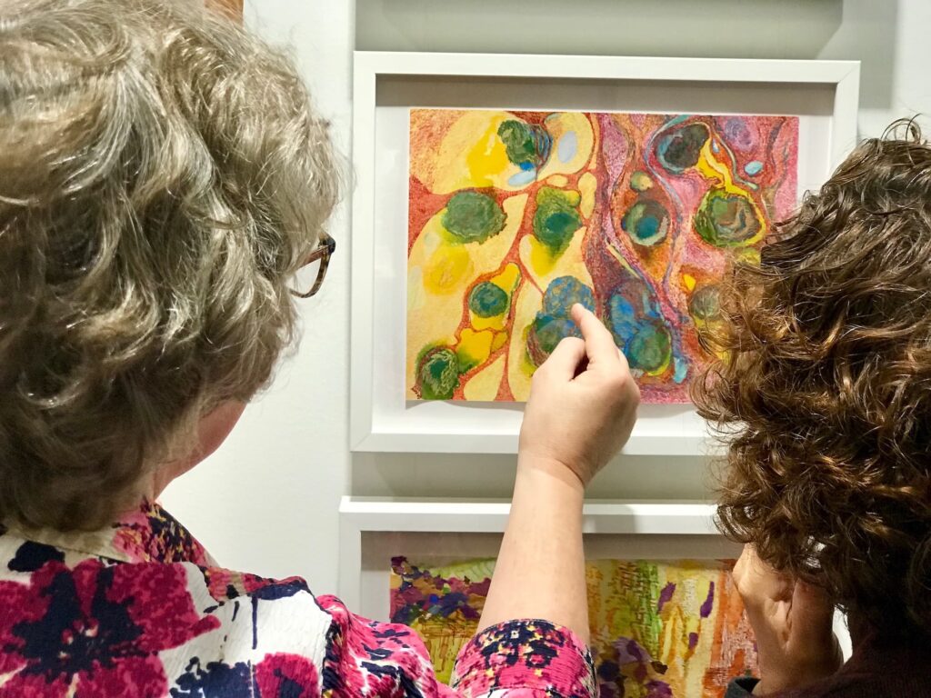 Viewers take in the work of artists who are living with dementia.