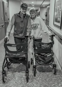 Jan visiting Jack in Memory Care Facility Grand Meadows