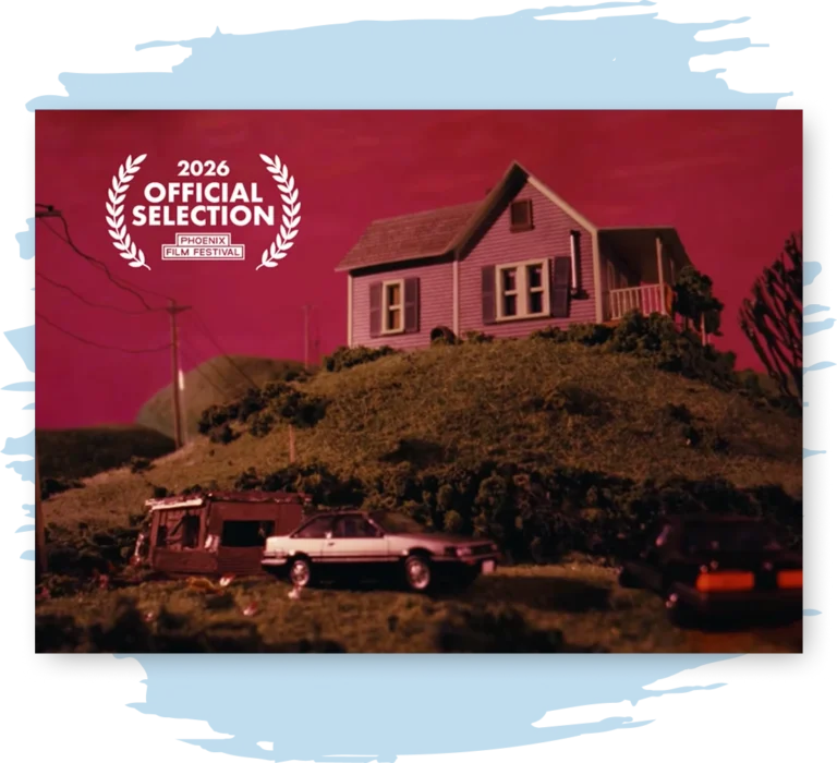 A diorama of a toy house on a hill with a dark red sky.
