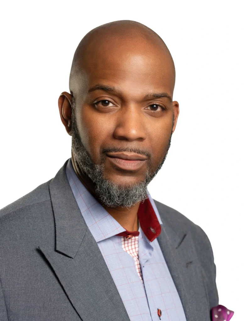 Headshot of Herb Caldwell, wearing a gray suit with a light blue undershirt