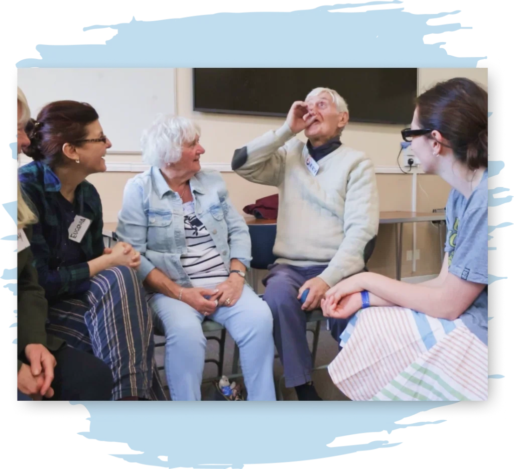A group of four people, two old and two young, reenact a memory together