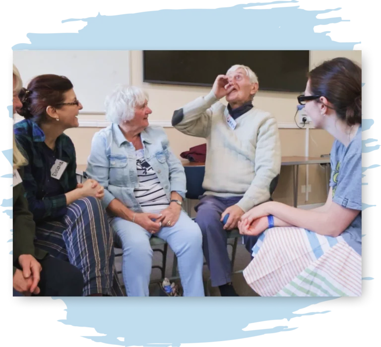 A group of four people, two old and two young, reenact a memory together